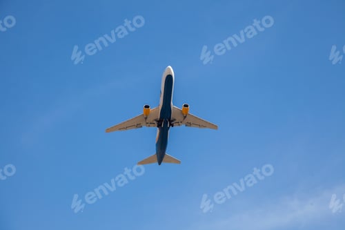 Preview: White plane flies in the sky. Bottom view. Takeoff and landing. Arrival and departure. Passenger