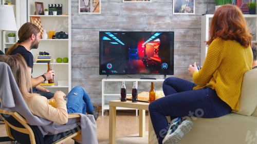 Preview: Cheerful caucasian friends playing video games