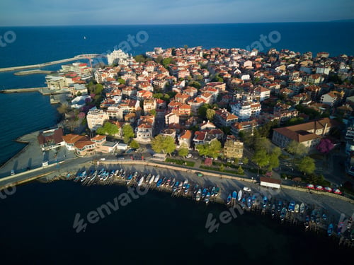 Preview: Promenade with people walking near Black Sea against backdrop of town Pomorie in Bulgaria