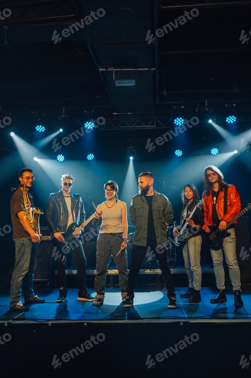Preview: Music band posing on stage under blue lights