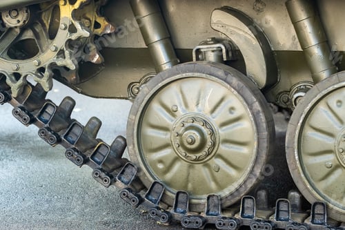 Preview: Tracked armor close-up. Black link tracks and large rubberized rollers. Chassis of an infantry