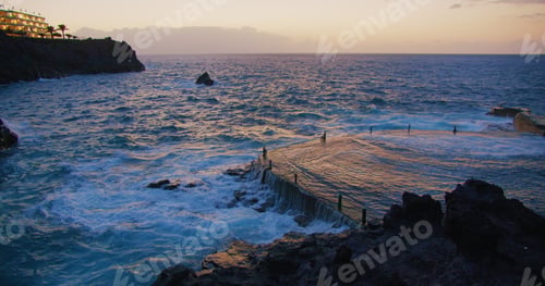 Preview: Natural pool, piscina natural of Acantilados de Los Gigantes at sunset. Ocean coast in town Puerto