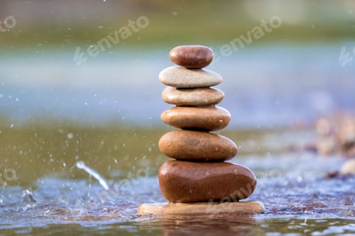 Preview: Close-up abstract image of wet rough natural brown uneven different sizes and forms stones