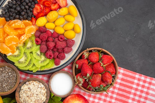 Preview: top view sliced fruits with fresh fruits on the dark background color salad fruit mellow ripe