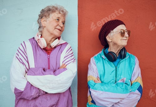 Preview: Fashion, headphones and senior women in city with blue and red wall background model for urban styl