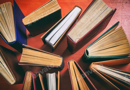 Preview: Vintage books on wooden background - top view