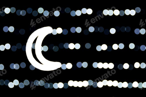Preview: Abstract bokeh of white city lights on black background. defocused and blurred with moon of lights