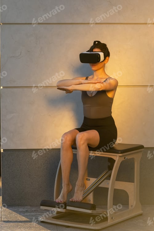 Preview: Beautiful girl doing pilates in the digital universe. Pilates reformer chair