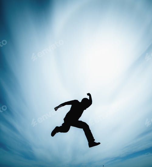 Preview: Man jumping against cloudy sky