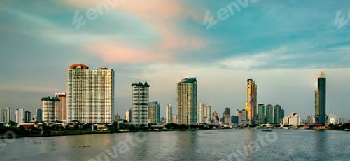 Preview: Cityscape of modern building near the river in the morning. Modern architecture office building.