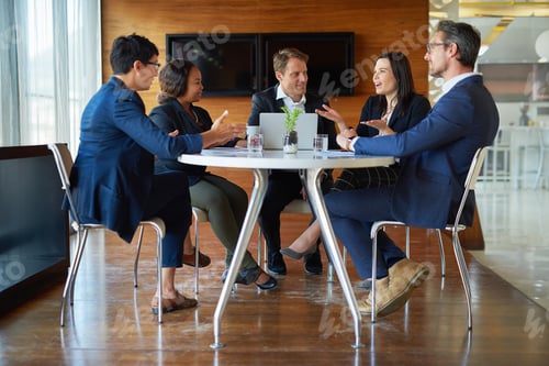Preview: Shot of a group of corporate businesspeople working in the boardroom