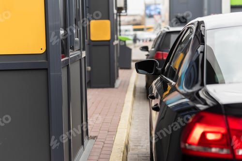 Preview: blurred modern cars in line on urban street