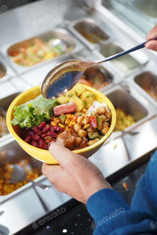 Preview: Creating a colorful bowl of mixed ingredients at a salad bar