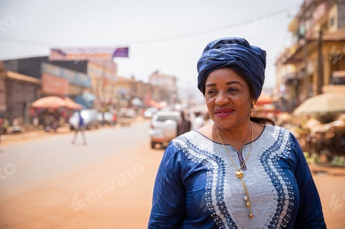 Preview: Portrait of a beautiful mature african lady in the city center in africa