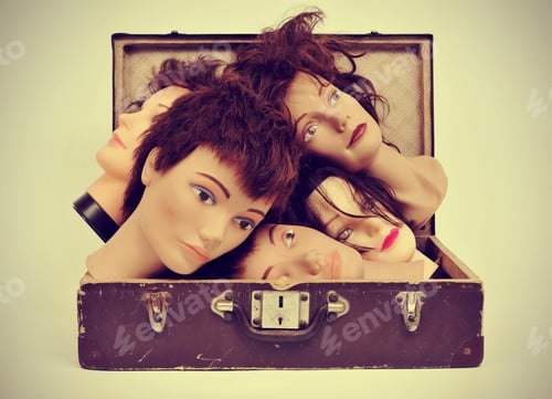 Preview: A Pile Of Mannequin Heads In An Old Suitcase With A Retro Effect