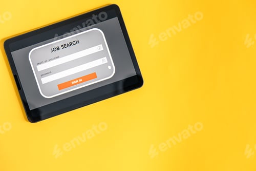 Preview: Top view of digital tablet with search job on screen on a yellow background.