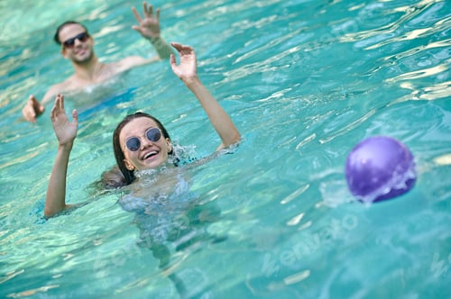 Preview: Young people having fun and enjoying at the swimming pool
