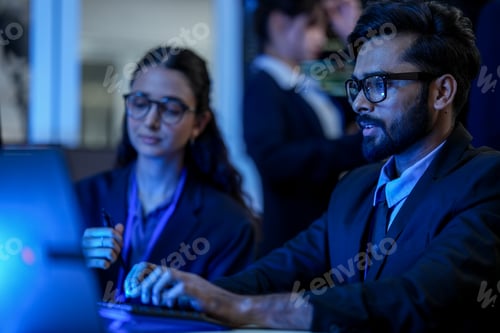 Preview: diverse team of AI developers collaborates on a night coding session.
