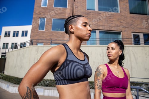 Preview: Two women standing outside during workout wearing sportswear