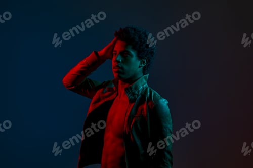 Preview: Portrait of young stylish man in neon red