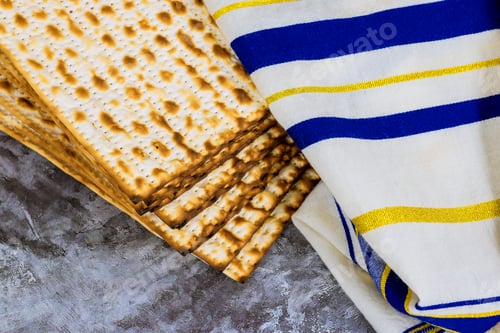 Preview: Matzah unleavened bread striped towel lay together during for traditional Jewish celebration