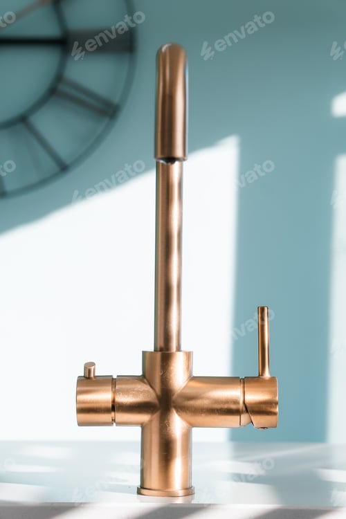 Preview: Gold kitchen tap faucet and sink, clean home interior