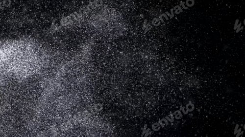 Preview: Abstract animation of small white particles exploding isolated on black background. Animation. White
