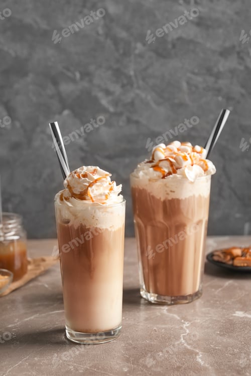 Preview: Glasses with delicious caramel frappe on table