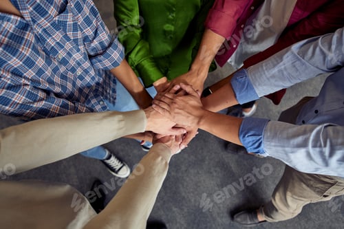 Preview: Top view of different ethnicity business people doing fists bump