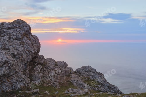 Preview: Sunset, sea and mountainside.