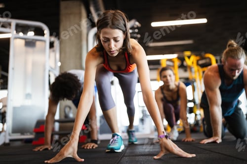Preview: Beautiful fit women working out in gym