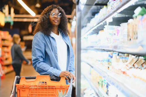 Preview: Cheerful African American Woman In Supermarket