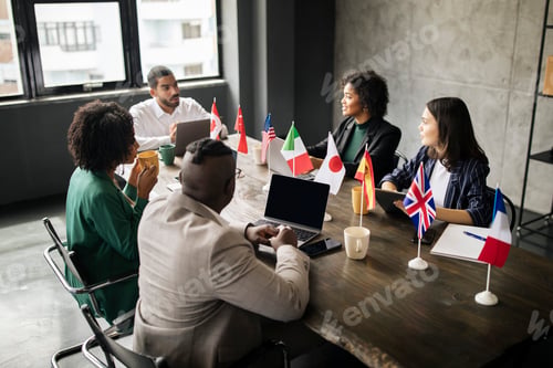 Preview: Multicultural Coworkers Businessmen And Businesswomen Sitting In Modern Office