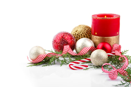 Preview: Holiday Ornament and Candle Arrangement on White Surface