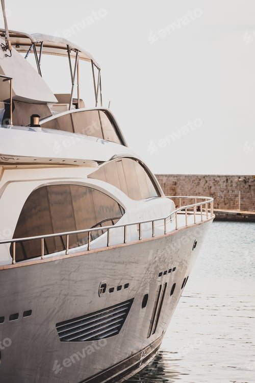 Preview: Vertical shot of a white luxury yacht sailing in the sea