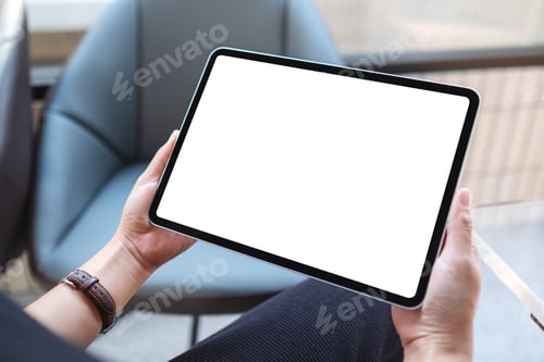 Preview: Mockup image of a woman holding digital tablet with blank white desktop screen in cafe