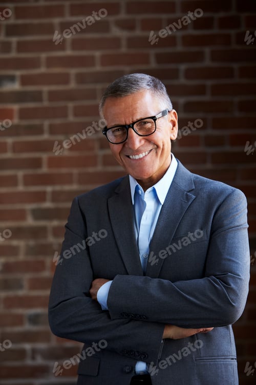Preview: Head And Shoulders Portrait Of Mature Businessman In Office