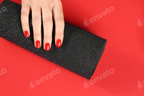 Preview: Woman showing manicured hand with red nail polish on color background, top view. Space for text