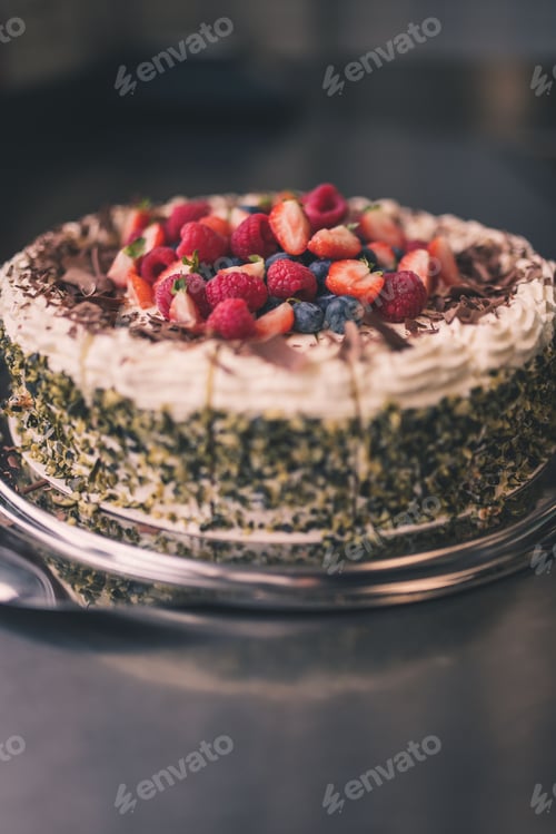 Preview: a cake with toppings on a plate sitting on a counter