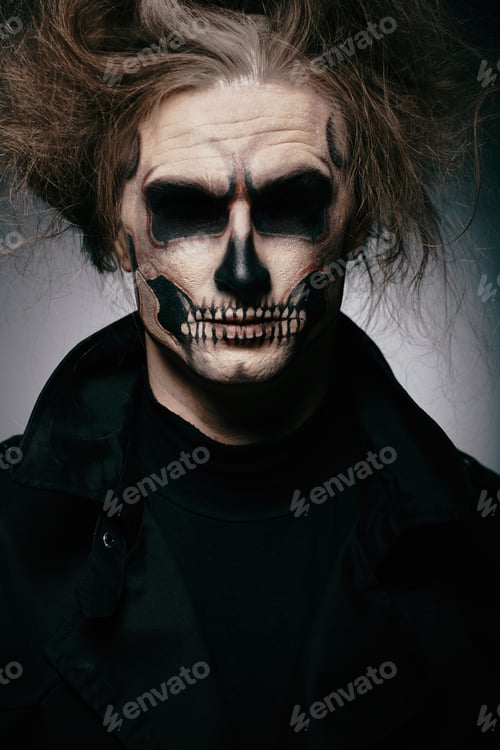 Preview: Skull makeup portrait of young man. Halloween face art.
