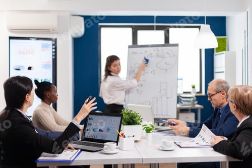 Preview: Company advisor making presentation using charts to staff