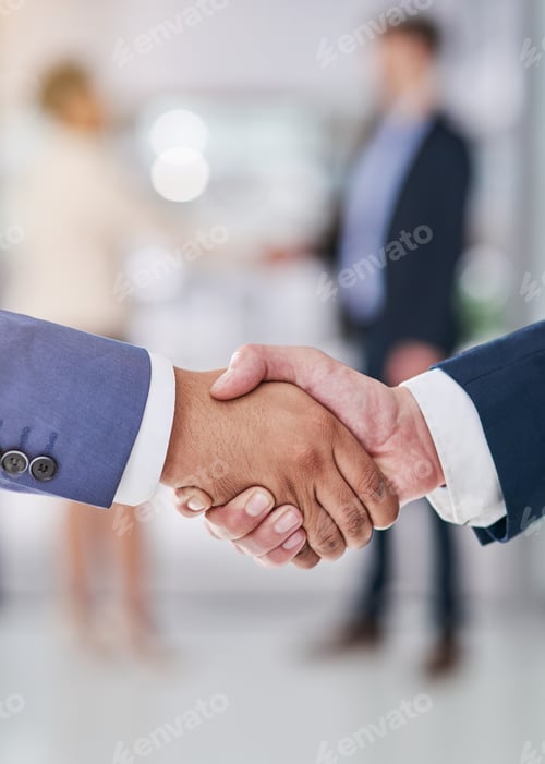 Preview: Company collaborations. Shot of businesspeople shaking hands.