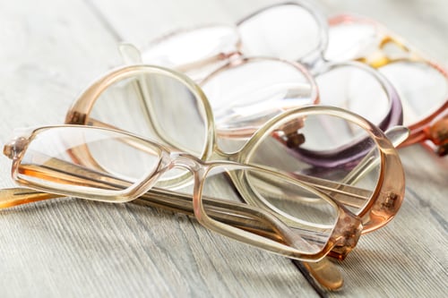 Preview: eyeglasses on wooden table