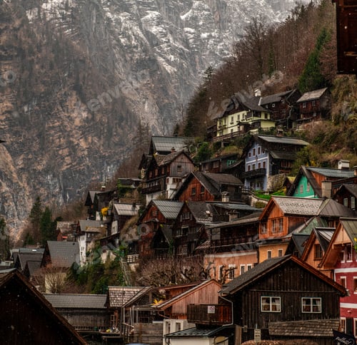 Preview: Scenic view of a small rural town with wooden houses in snowy mountains