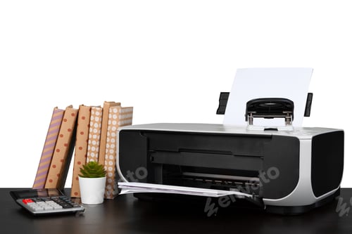 Preview: Printer and stack of books on black table against white background