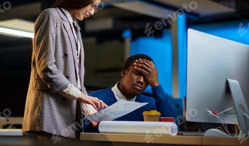 Preview: Tired managers works in night office
