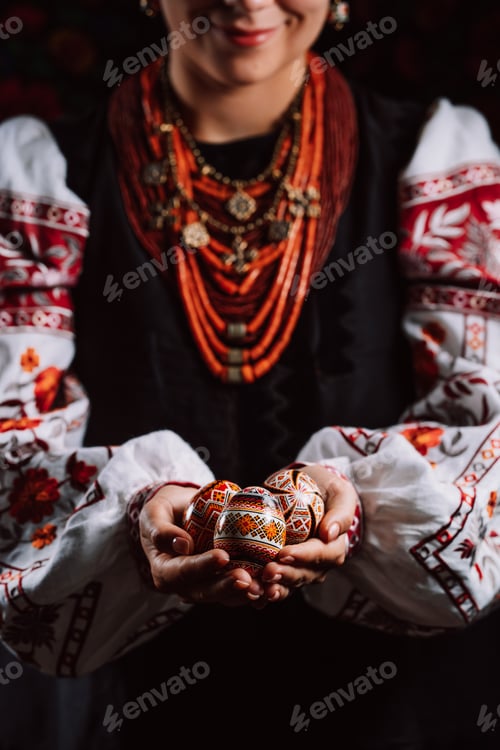 Preview: Ukrainian woman hand painted Easter eggs. Geometric slavic decoration ornaments