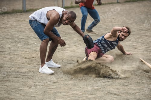 Preview: group of young multiethnic men playing baseball on court