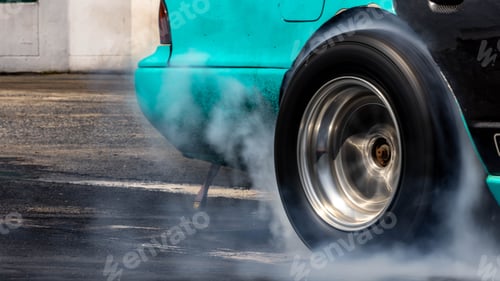 Preview: Car burnout wheels tire with white smoke,Car wheel burnout with smoke from the spinning tyre.