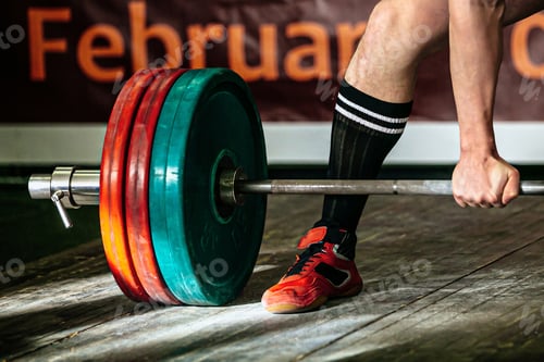 Preview: part barbell and body powerlifter stand on wooden floor, powerlifting competition deadlift